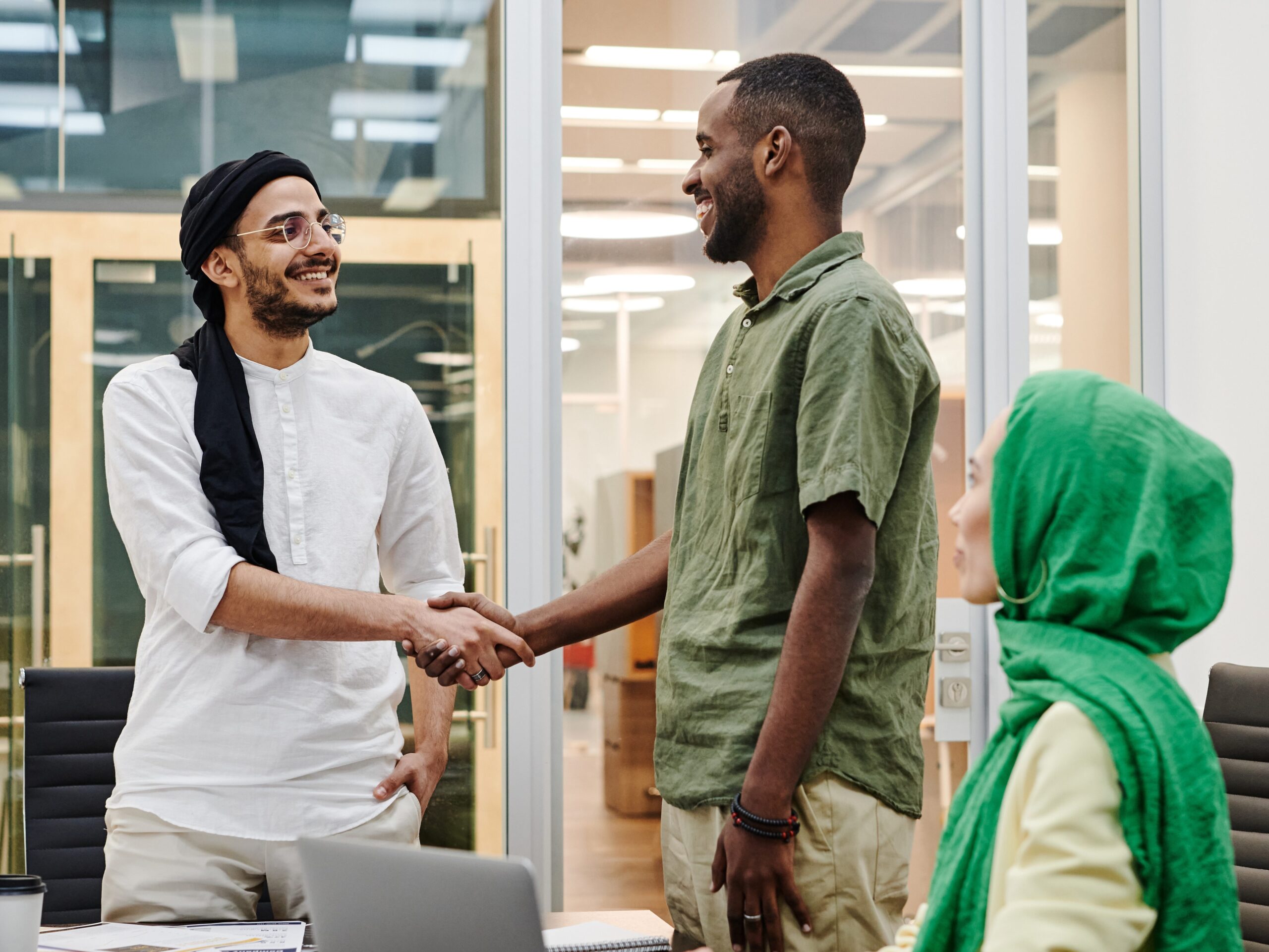 A group of people that are shaking hands.